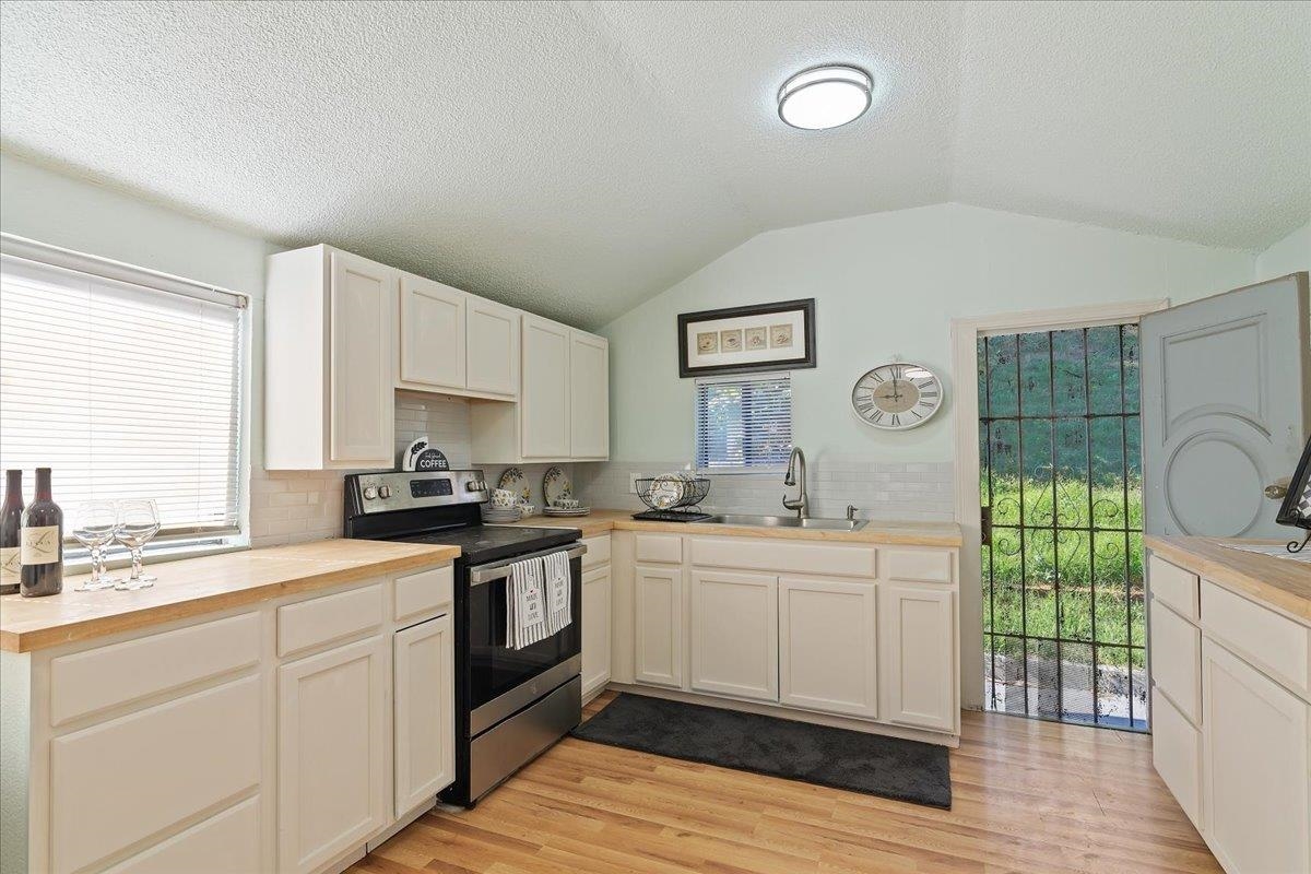 2108 Taylor Road Bethel Island, CA 94511 - Photo 11 of 31 a kitchen with a sink stove and cabinets
