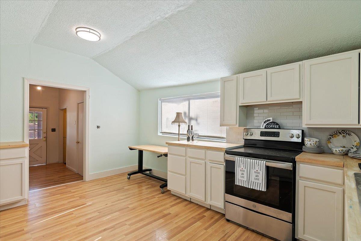 2108 Taylor Road Bethel Island, CA 94511 - Photo 14 of 31 a kitchen with stainless steel appliances granite countertop a stove and white cabinets