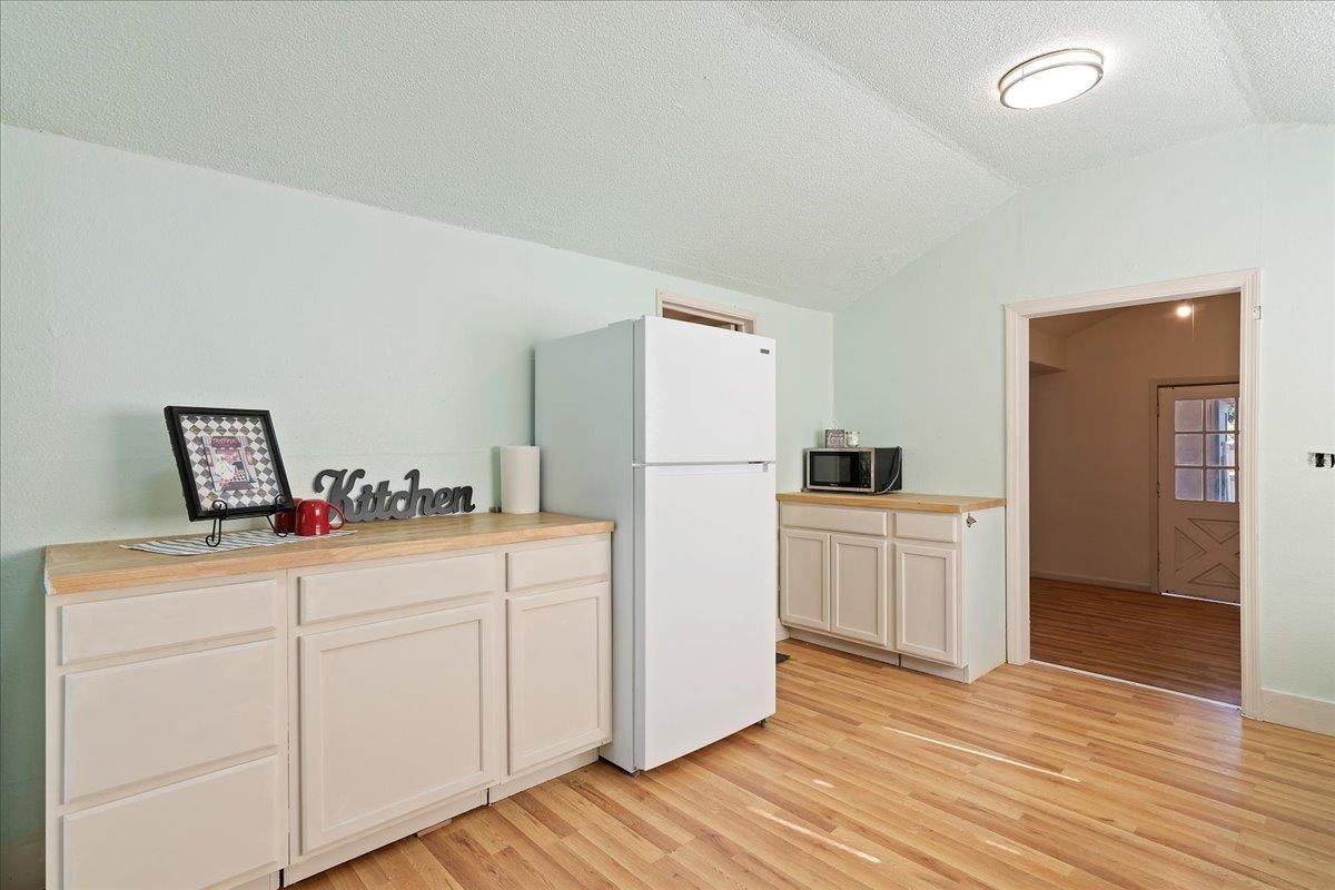 2108 Taylor Road Bethel Island, CA 94511 - Photo 15 of 31 a kitchen with white cabinets and refrigerator