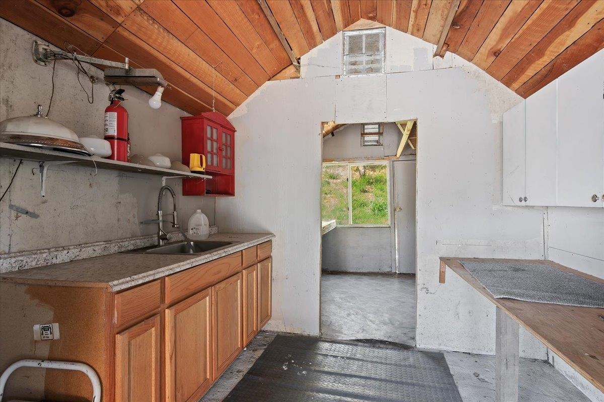 2108 Taylor Road Bethel Island, CA 94511 - Photo 19 of 31 a kitchen with kitchen island a counter top space a sink stainless steel appliances and cabinets