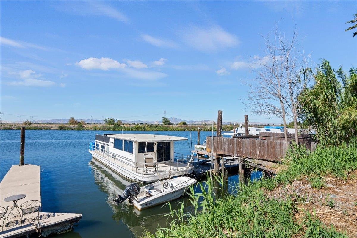 2108 Taylor Road Bethel Island, CA 94511 - Photo 20 of 31 a roof deck with table and chairs a barbeque and potted plants