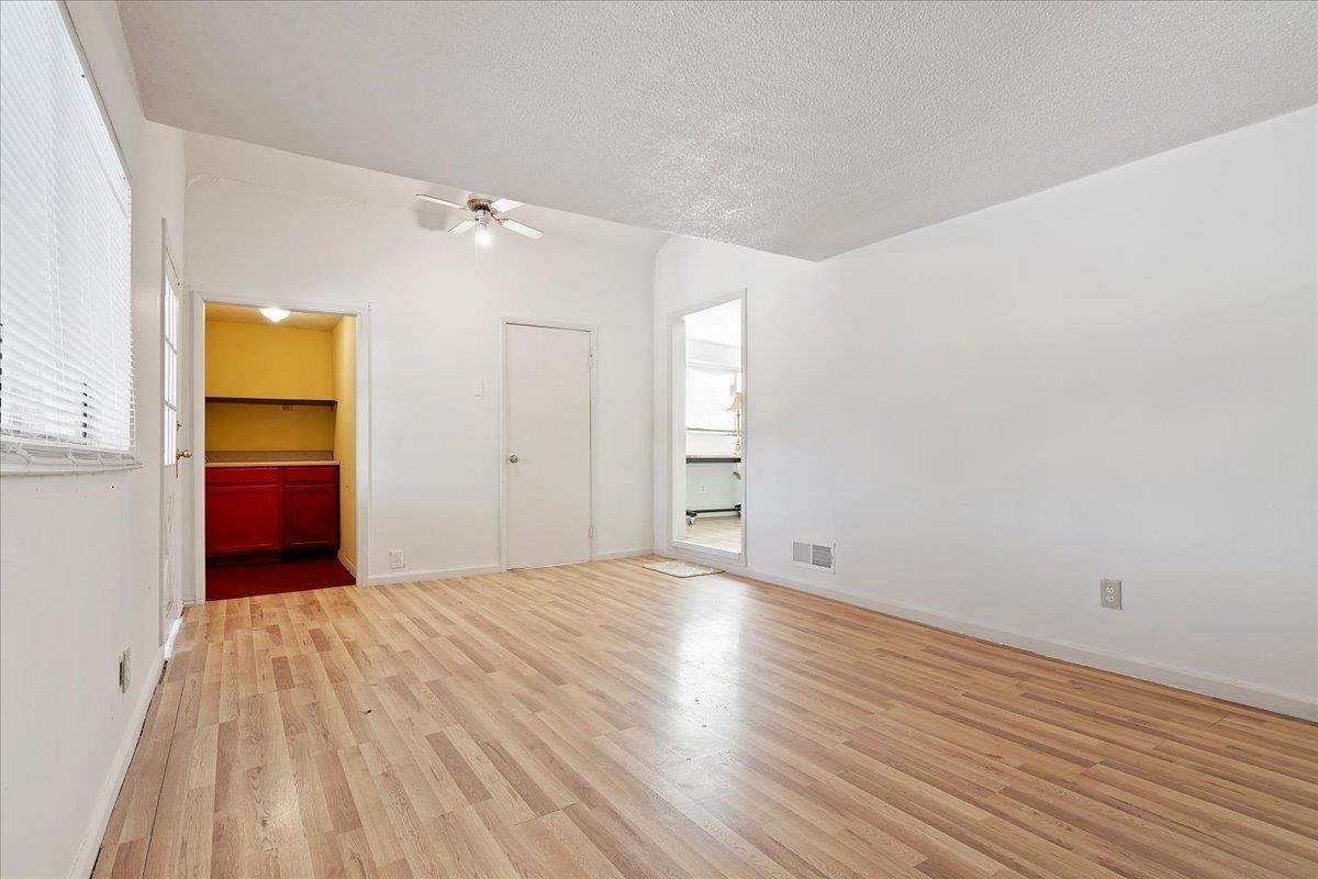 2108 Taylor Road Bethel Island, CA 94511 - Photo 10 of 31 a view of empty room with wooden floor and fan