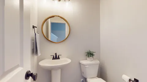 a view of an empty room with a bathroom