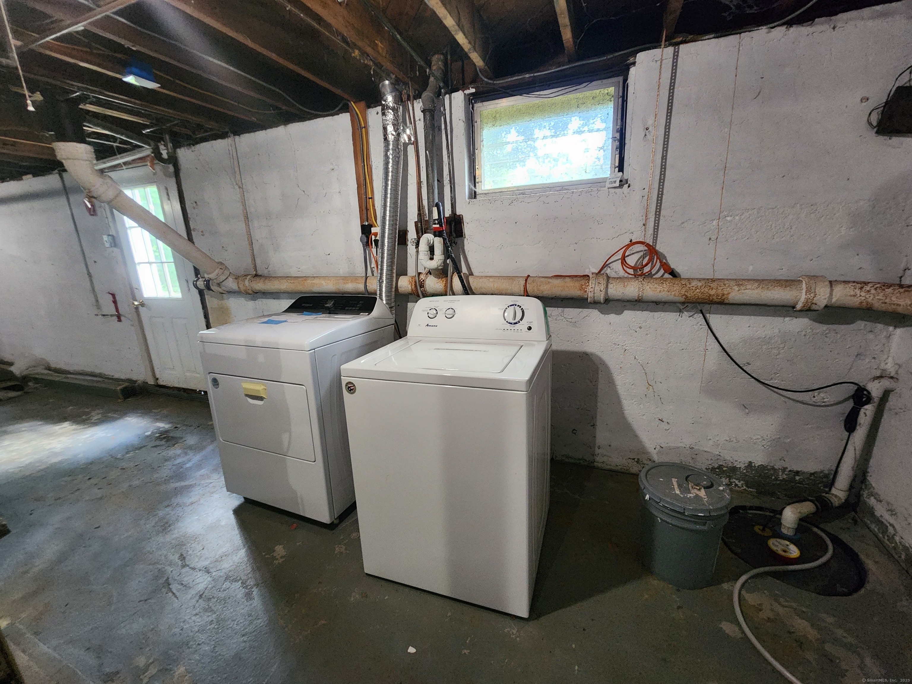 79 Honor Road West Haven, CT 06516 - Photo 27 of 36 a view of storage and utility room with washer and dryer