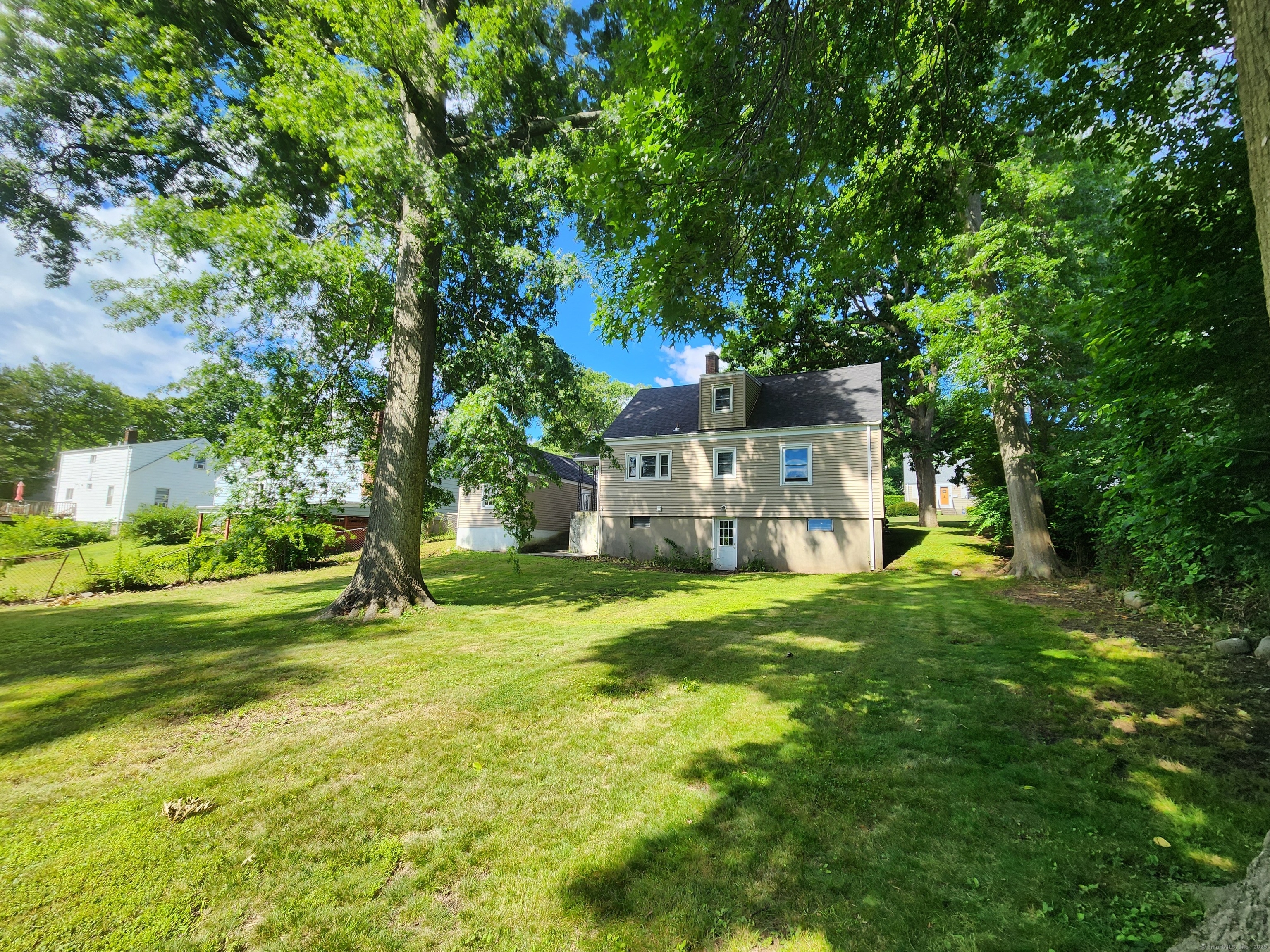 79 Honor Road West Haven, CT 06516 - Photo 32 of 36 a view of a house with a big yard and large trees