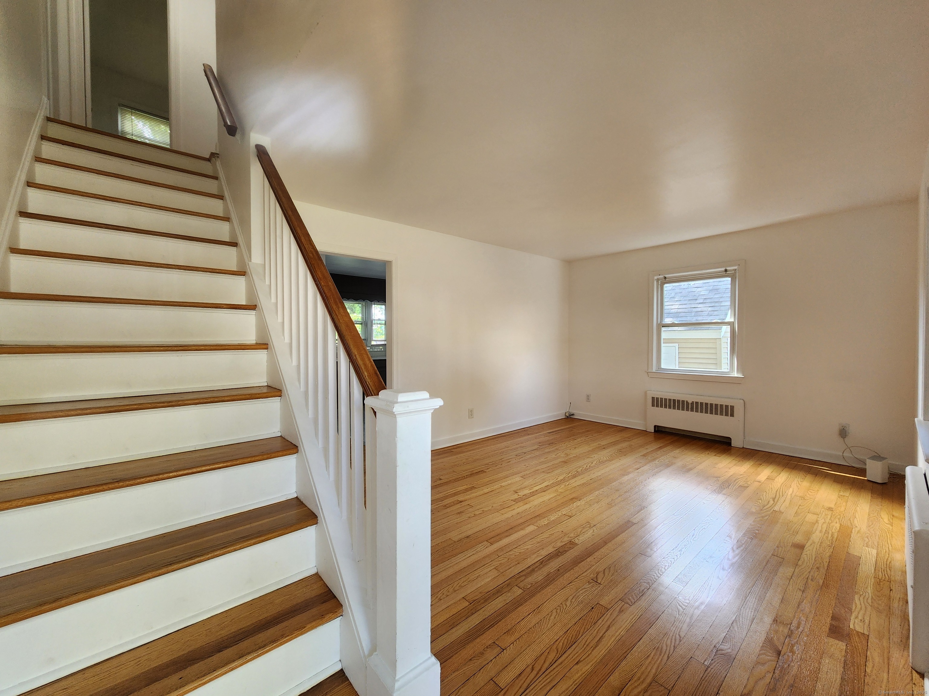 79 Honor Road West Haven, CT 06516 - Photo 6 of 36 a view of wooden floor and windows in a room