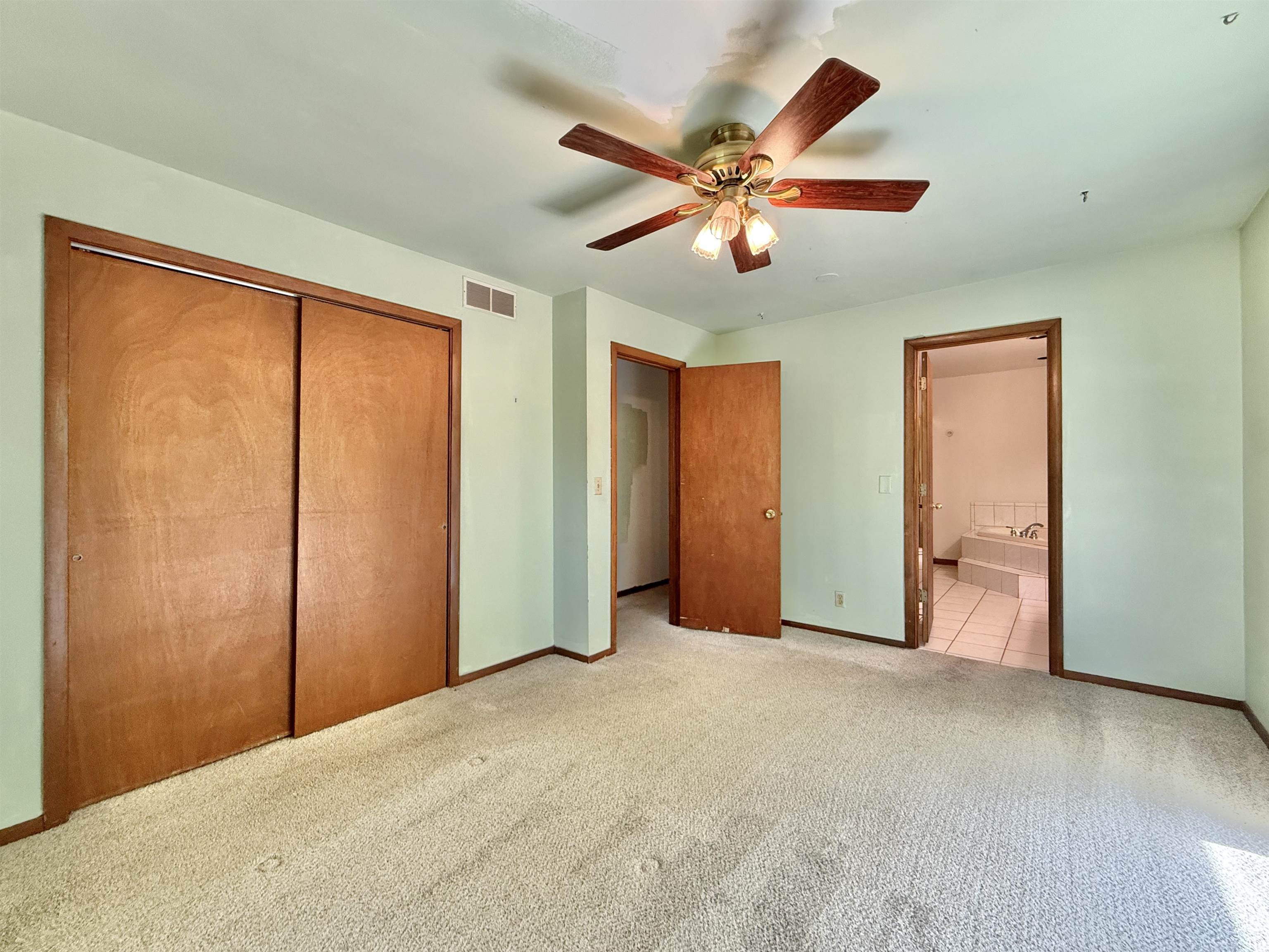 3620 Valerie Road Roscoe, IL 61073 - Photo 13 of 26 a view of an empty room with window and closet area
