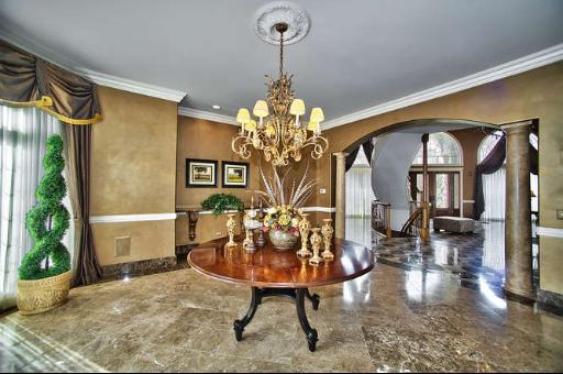 9381 Falling Waters Drive West Burr Ridge, IL 60527 - Photo 2 of 15 a view of a dining room with furniture and a chandelier