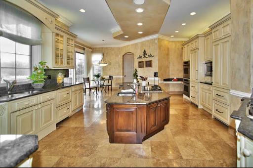 9381 Falling Waters Drive West Burr Ridge, IL 60527 - Photo 6 of 15 a large kitchen with stainless steel appliances lots of counter top space