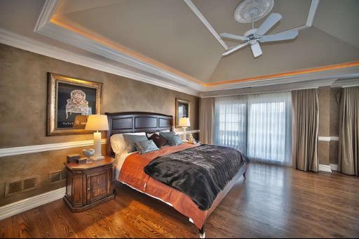 9381 Falling Waters Drive West Burr Ridge, IL 60527 - Photo 7 of 15 a bedroom with a bed and wooden floor