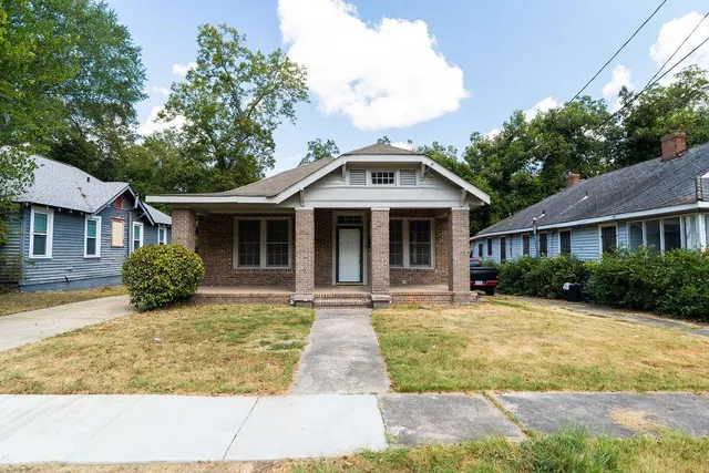 front view of a house with a yard