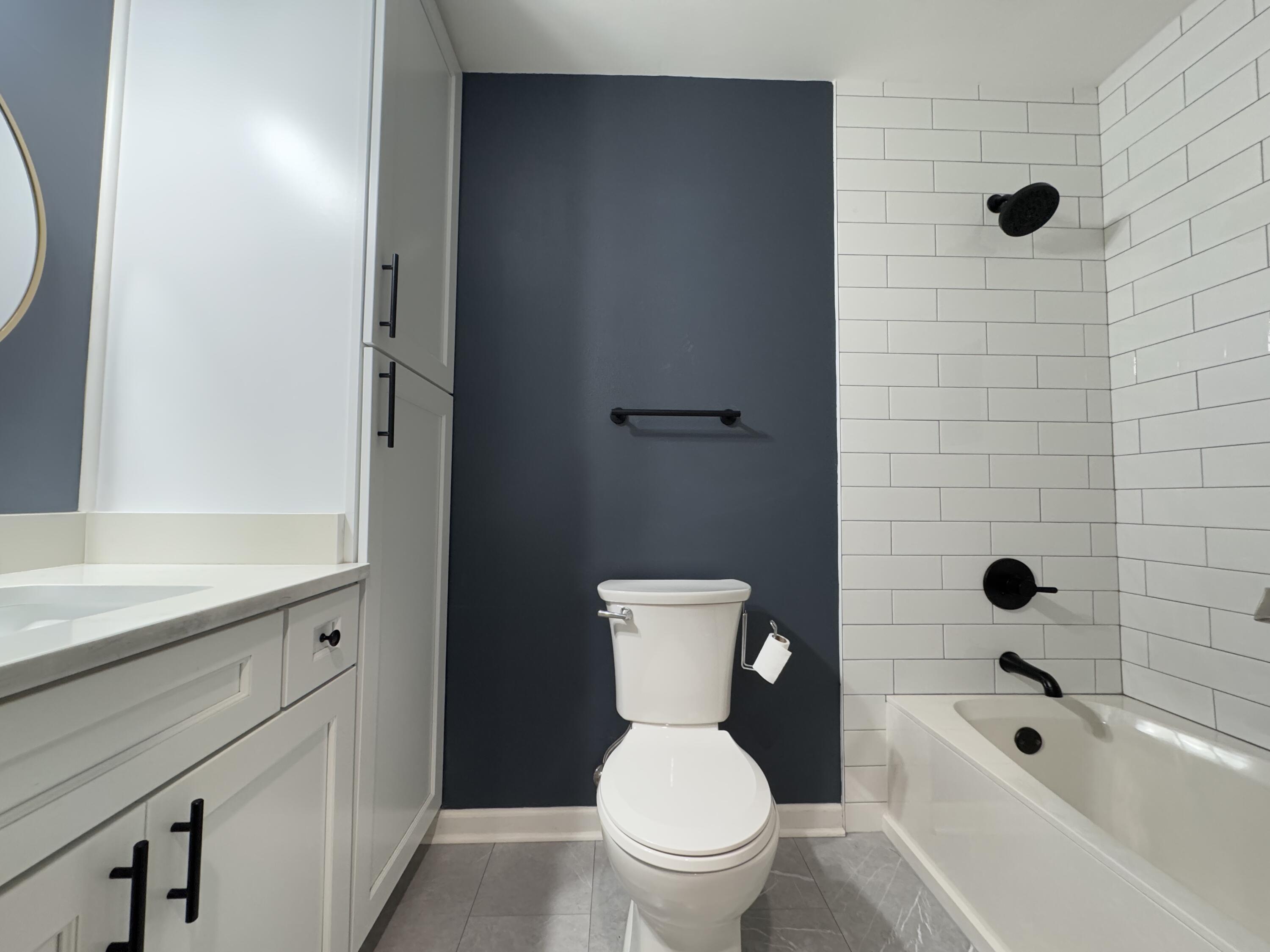 520 Justin Street Fort Walton Beach, FL 32547 - Photo 12 of 19 a bathroom with a sink a toilet and shower