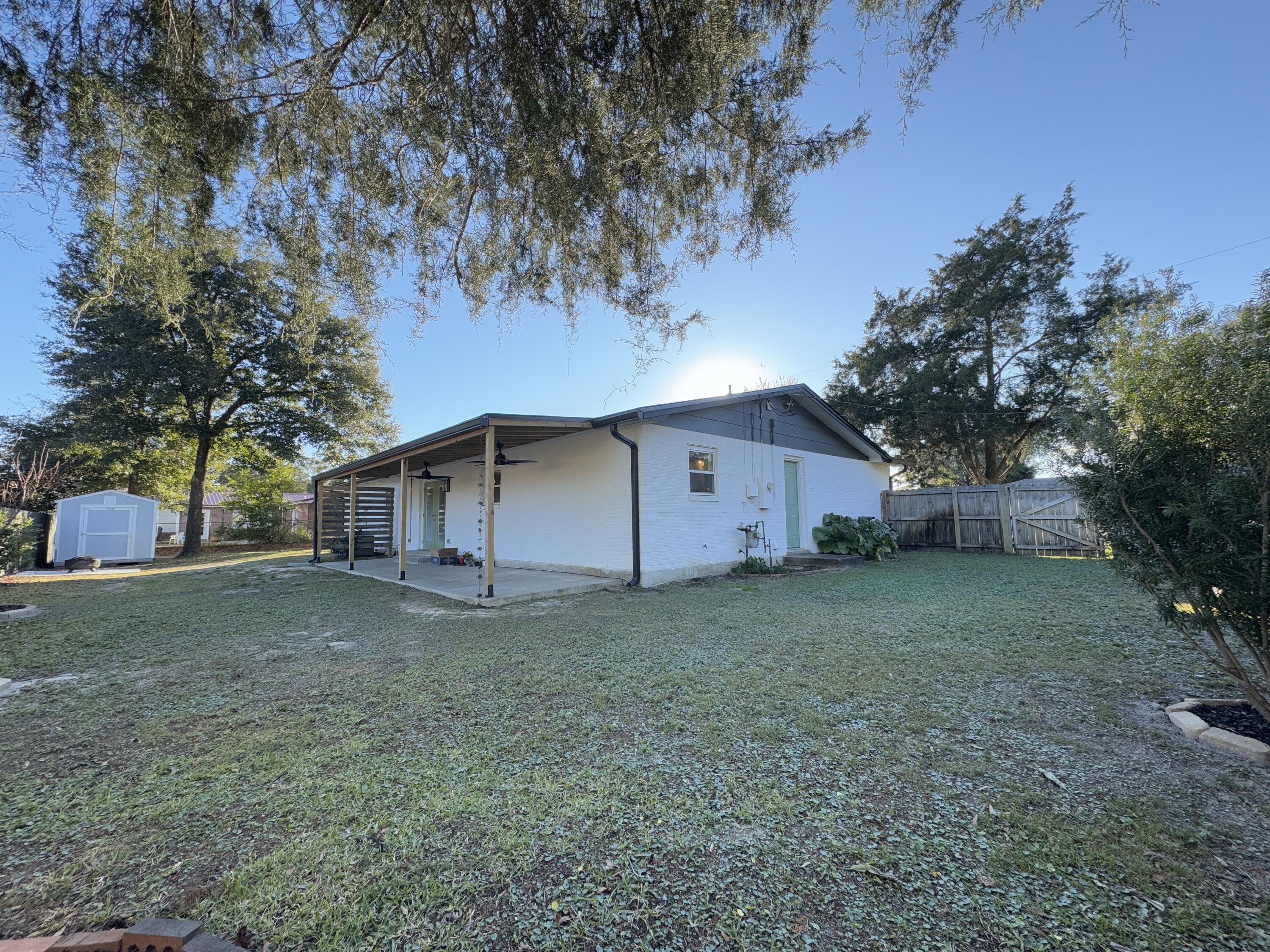 520 Justin Street Fort Walton Beach, FL 32547 - Photo 17 of 19 a house that has a tree in front of it