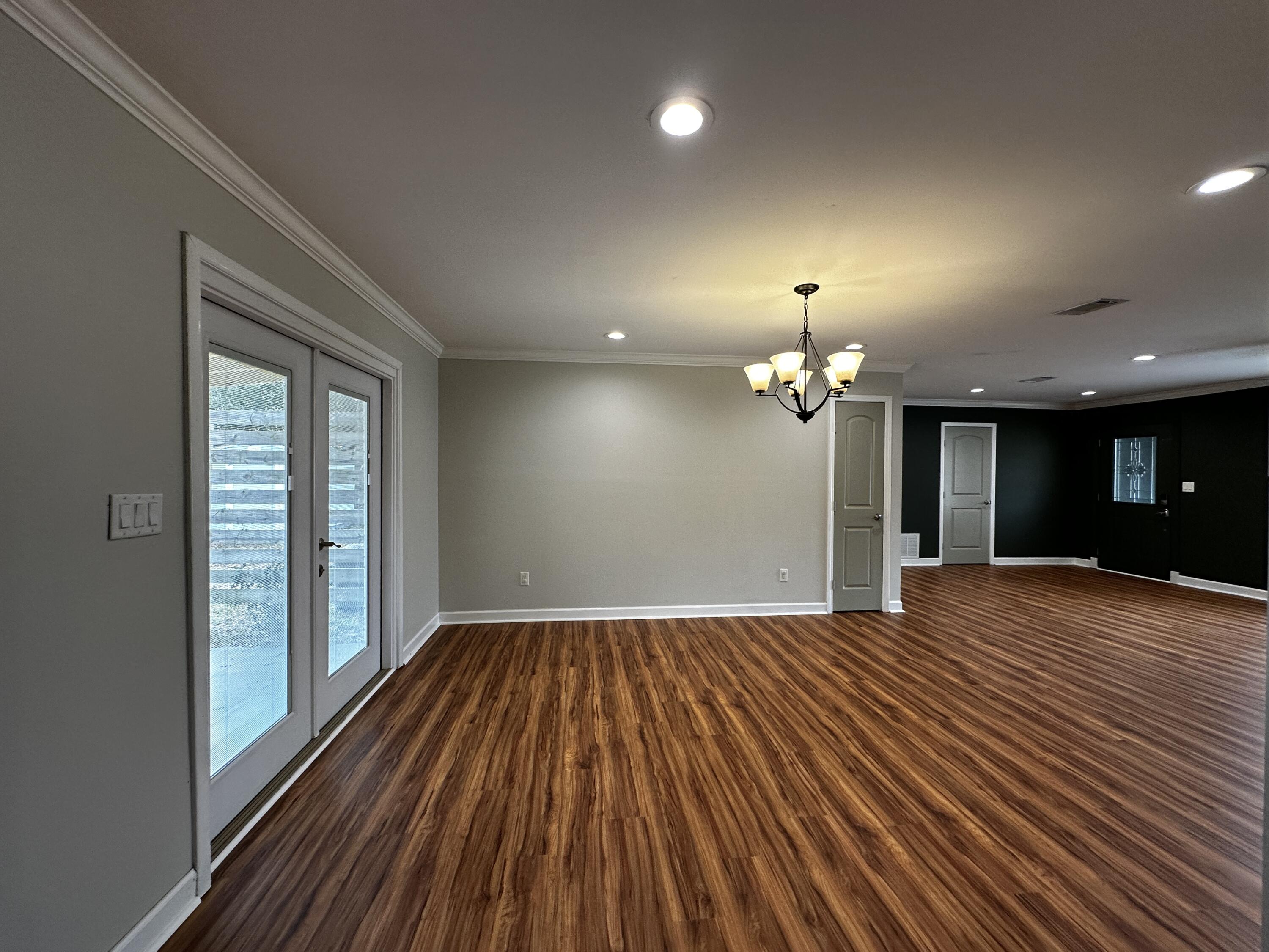 520 Justin Street Fort Walton Beach, FL 32547 - Photo 6 of 19 a view of a livingroom with a chandelier fan and a window