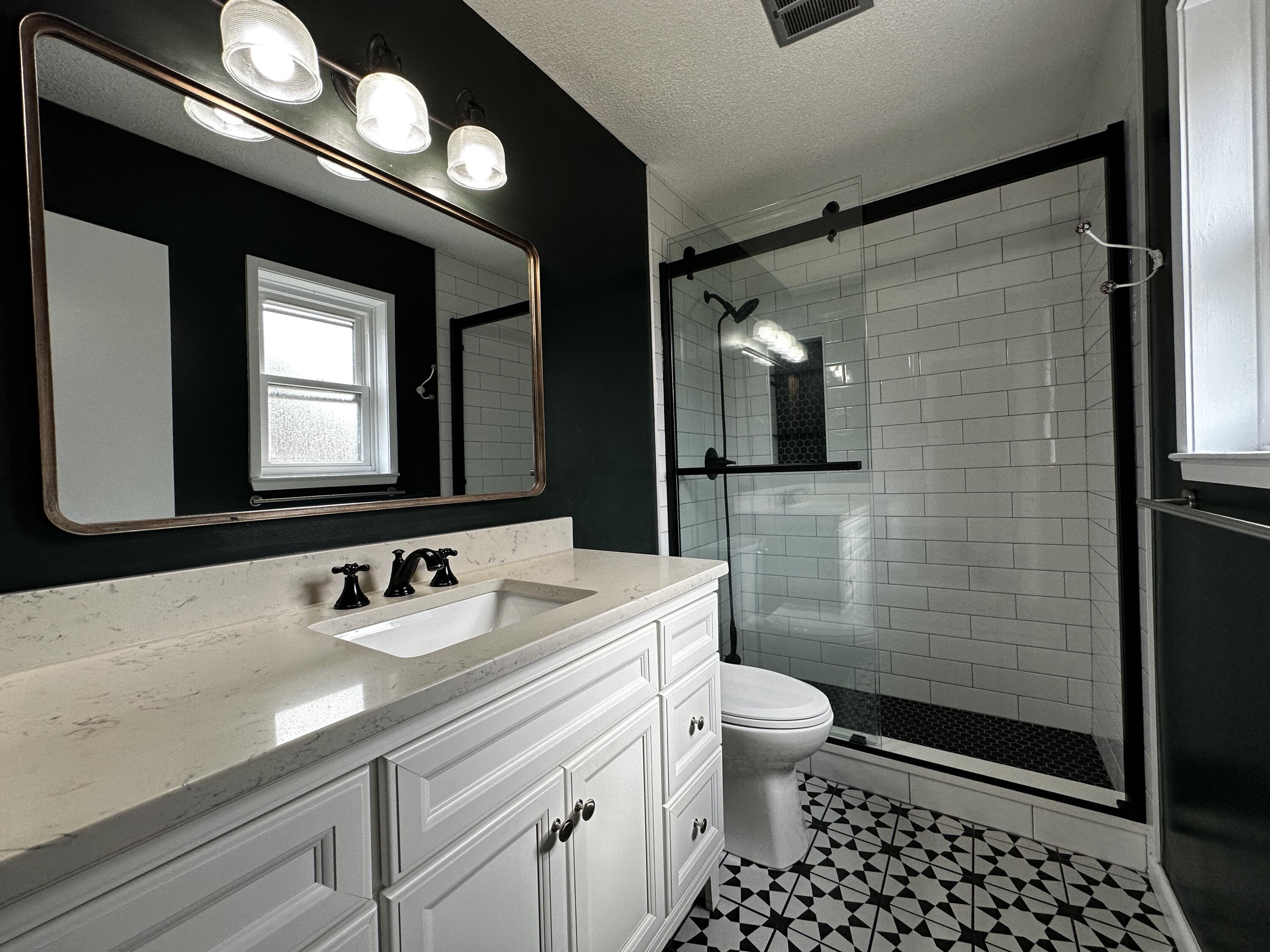 520 Justin Street Fort Walton Beach, FL 32547 - Photo 8 of 19 a bathroom with a sink a toilet and shower