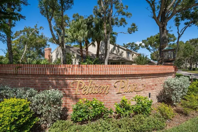 a view of sign board with wooden fence