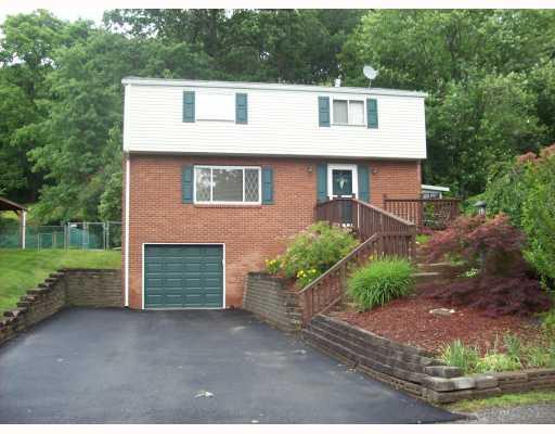 867 Blue Ridge Drive Plum, PA 15239 - Photo 1 of 13 Exterior Front. NICE CURB APPEAL WITH PAVED DRIVE AND NEWER GARAGE DOOR.