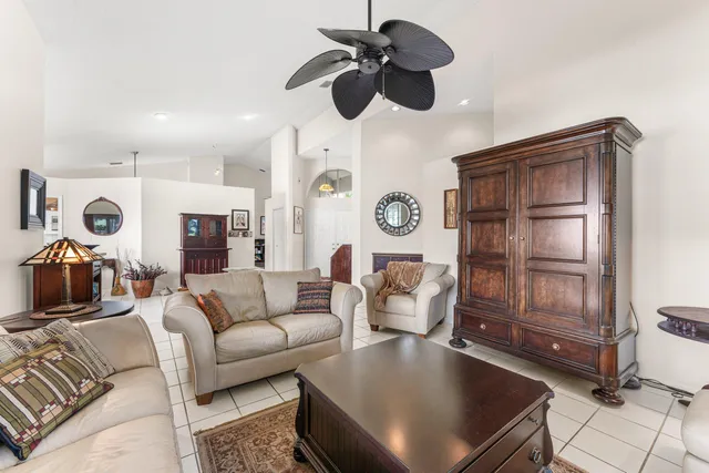 a bathroom with a granite countertop sink mirror vanity and toilet