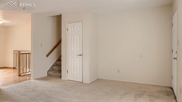 2515 Ranch Lane Colorado Springs, CO 80918 - Photo 7 of 25 Living Room Looking toward Kitchen & Dining Area