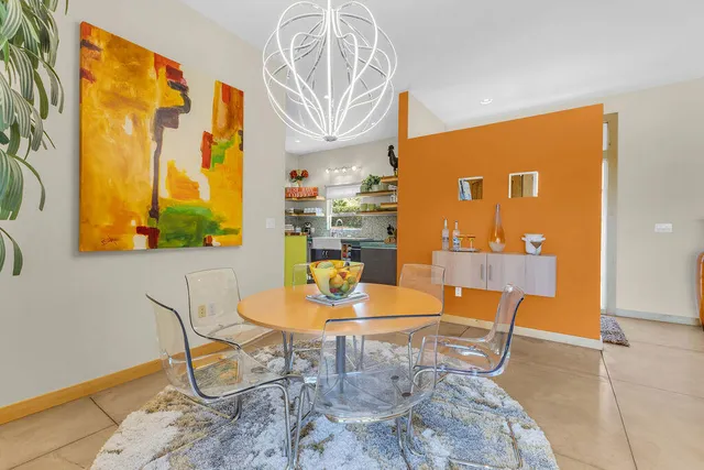 a kitchen with stainless steel appliances granite countertop a refrigerator and a stove