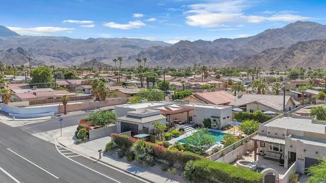 an aerial view of residential houses and outdoor space
