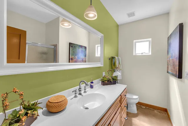 a living room with lots of furniture and white walls