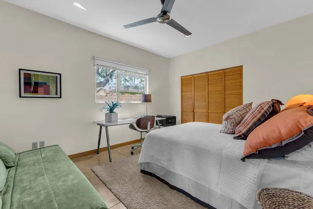 a view of a patio with a table and chairs