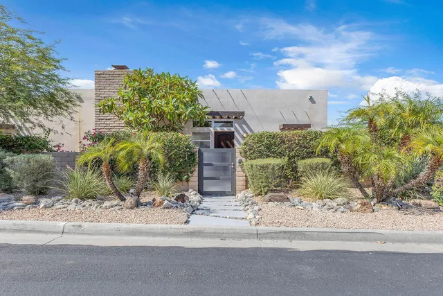 a living room with fireplace furniture and a flat screen tv