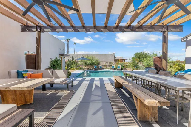 a view of a patio with a table and chairs