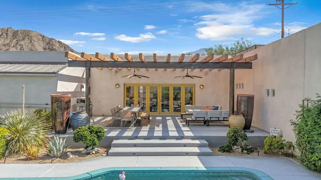 a view of a pathway of a house with a yard
