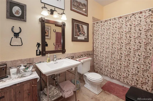 a spacious bedroom with a bed and a large window