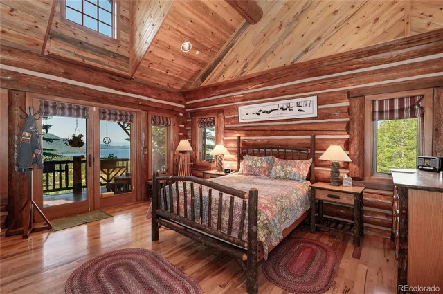 a view of a houses with a lush green hillside