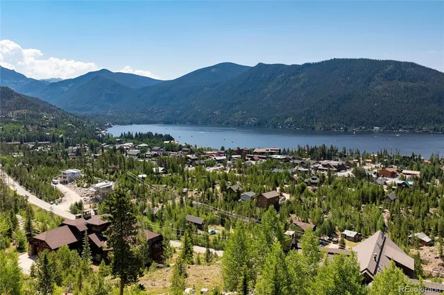a view of table and chairs under an umbrella