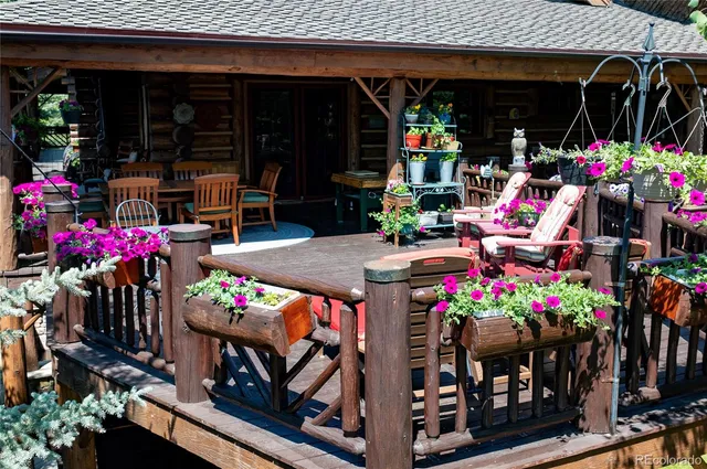 a view of balcony with wooden floor and outdoor seating