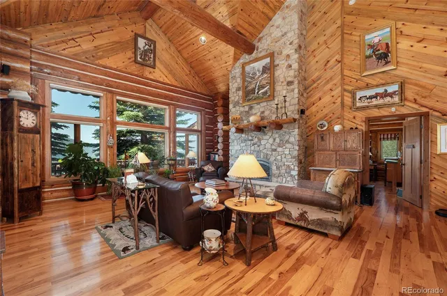 a view of a patio with dining table and chairs with wooden floor and fence