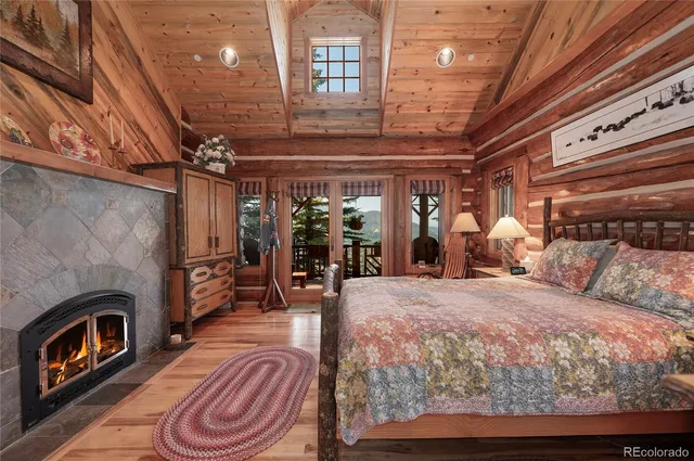 a bed room with a bed and a fireplace