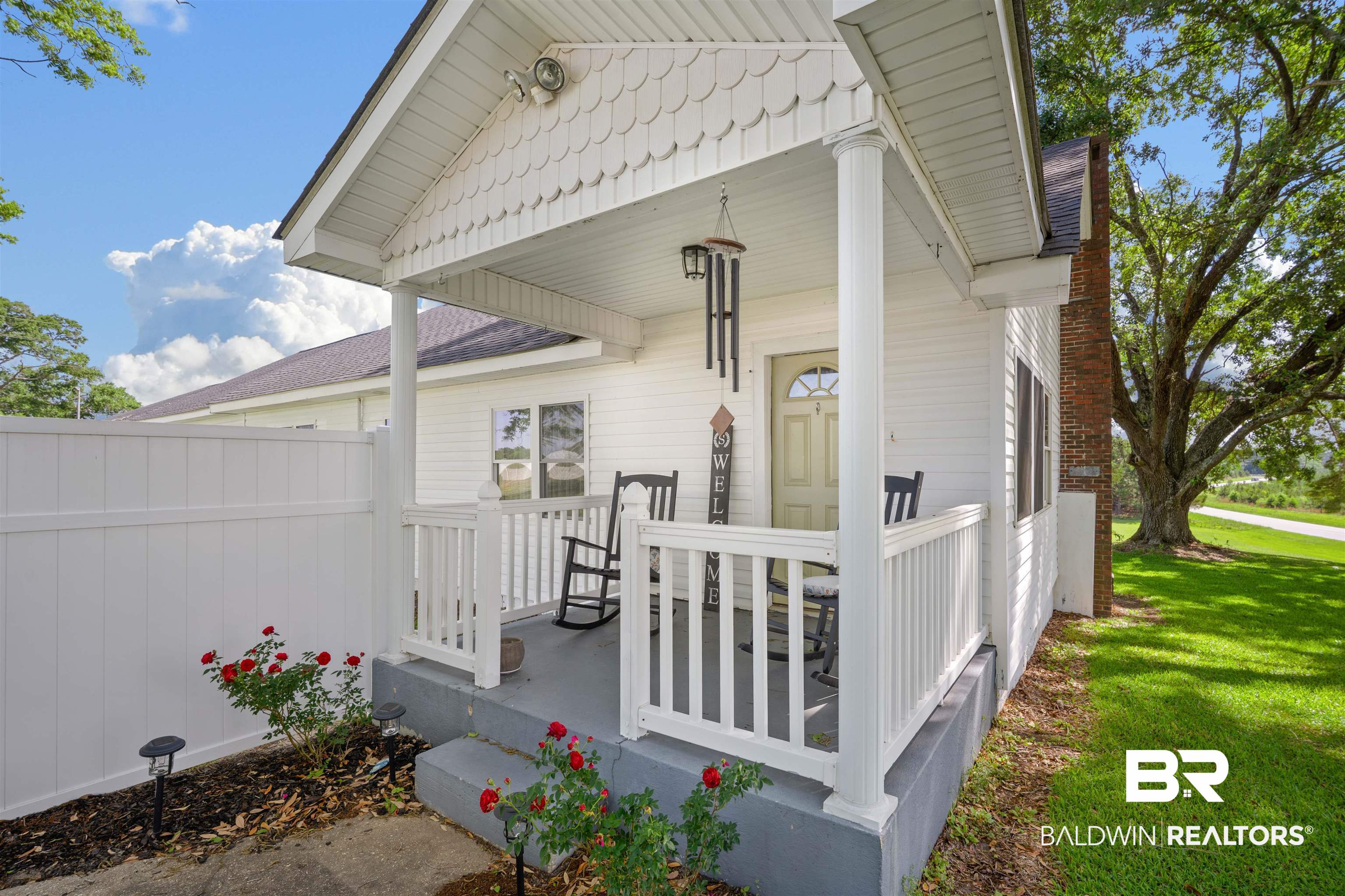 View of exterior entry with covered porch