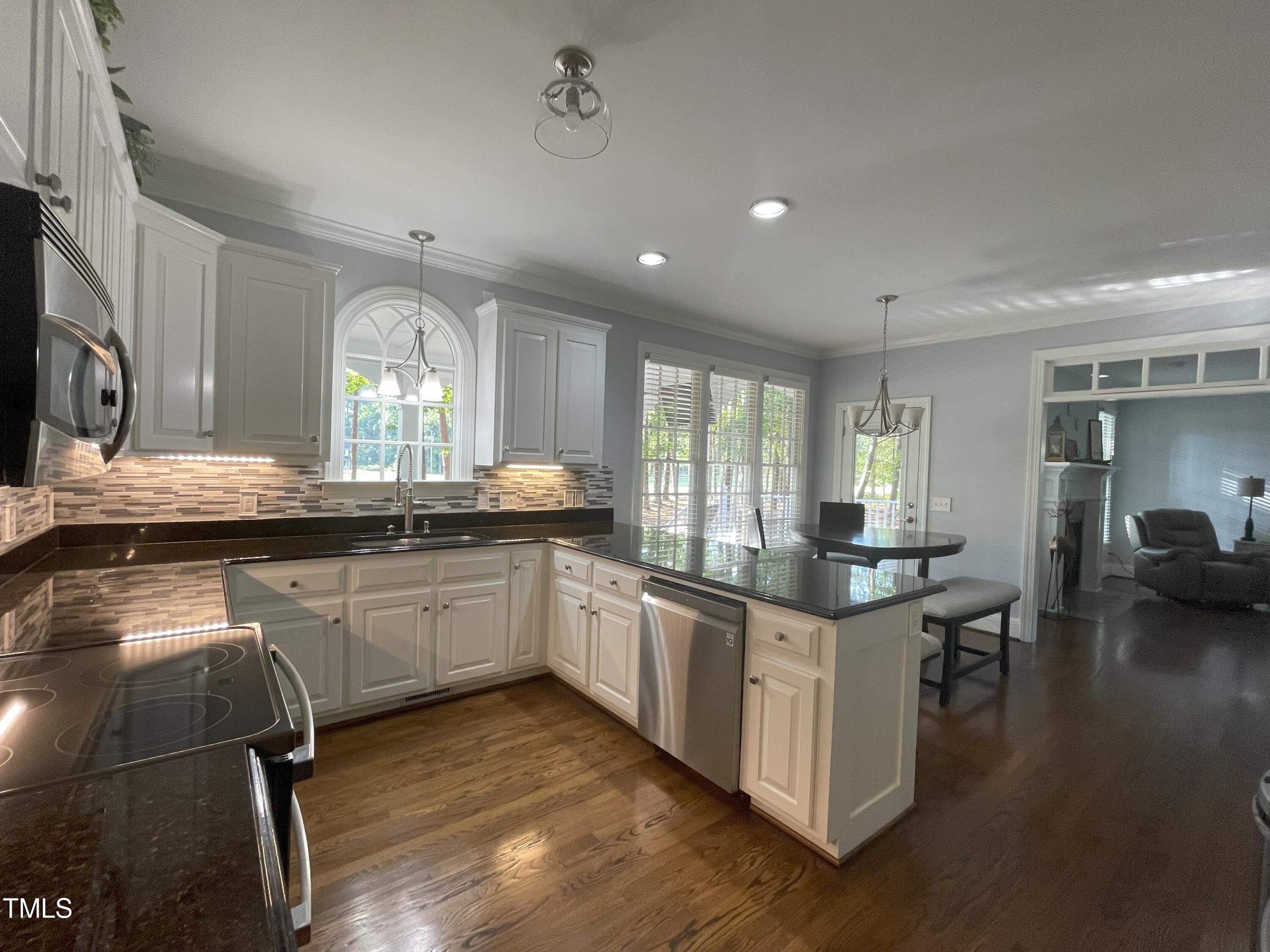 3033 Pearces Road Zebulon, NC 27597 - Photo 7 of 42 10_Kitchen_Breakfast Area with view of L