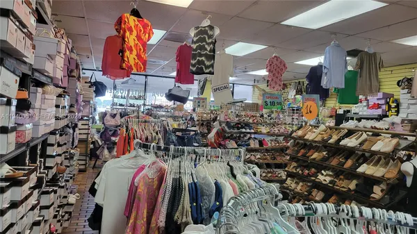 a store room with lots of different colored cloths