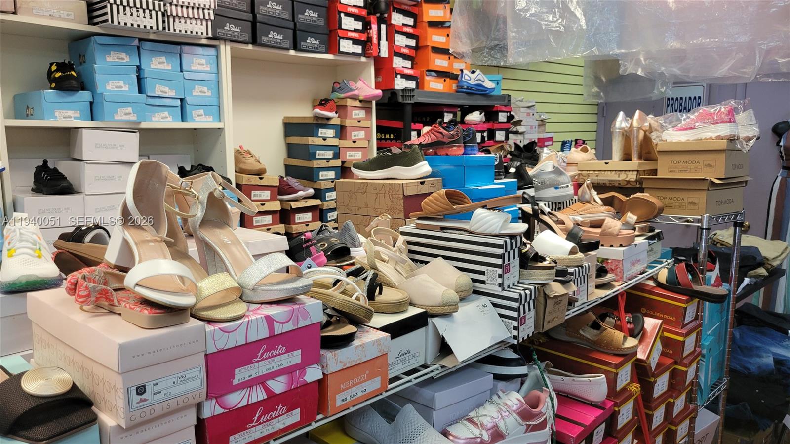 4036 West 12th Avenue Hialeah, FL 33012 - Photo 14 of 16 a store room with lots of different colored cloths