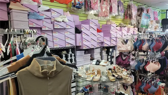 a store room with lots of different colored cloths