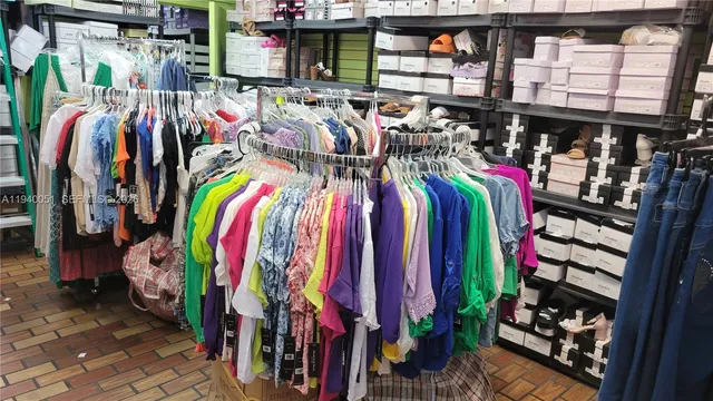 a view of walk in closet with clothes