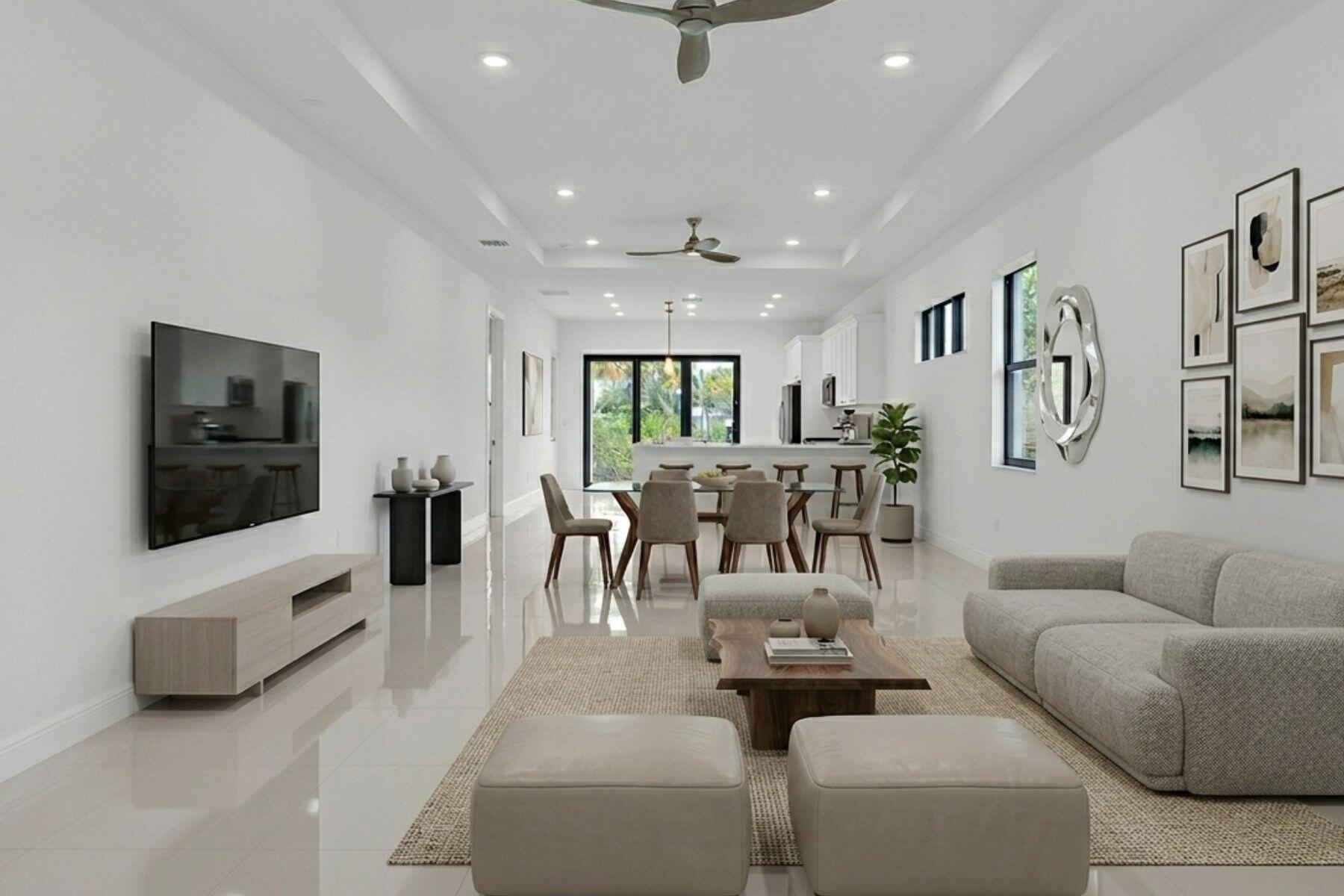 5501 Santa Rosa Lane Westlake, FL 33470 - Photo 6 of 31 a living room with furniture and a flat screen tv