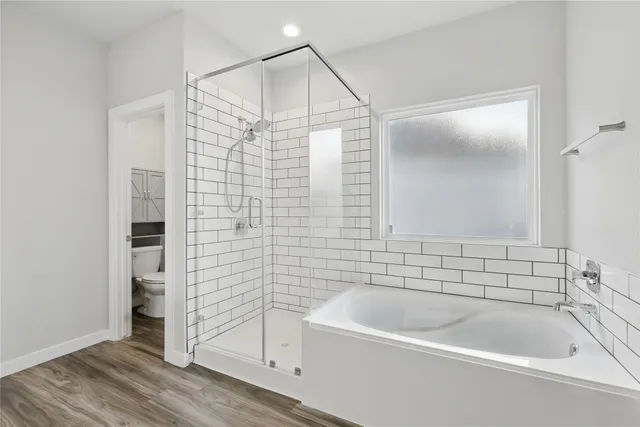 a bathroom with a bathtub and a shower
