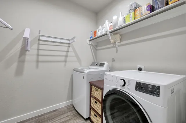 a view of a storage & utility room with washer and dryer
