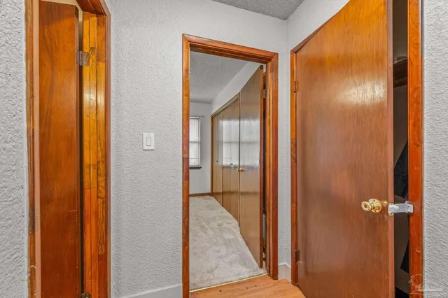 a view of a bathroom from a hallway