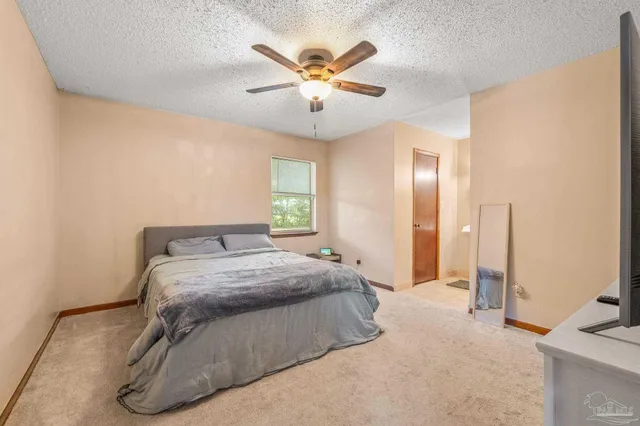 a bedroom with a bed and window