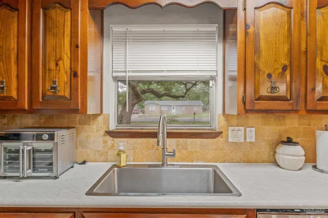 a kitchen with a sink and a window