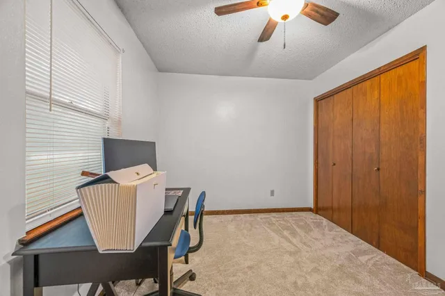 a workspace with furniture and window