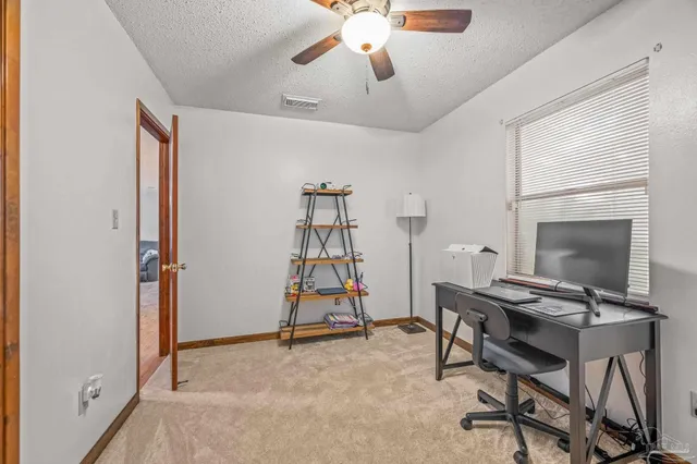 a view of a workspace with furniture